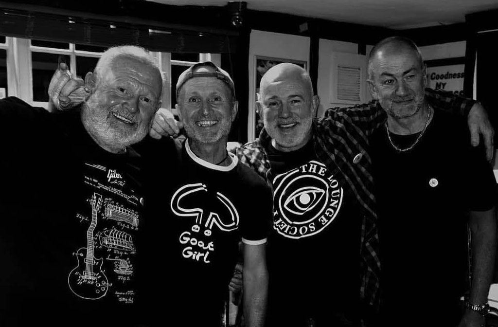 A black and white photo of the band Dead Shady