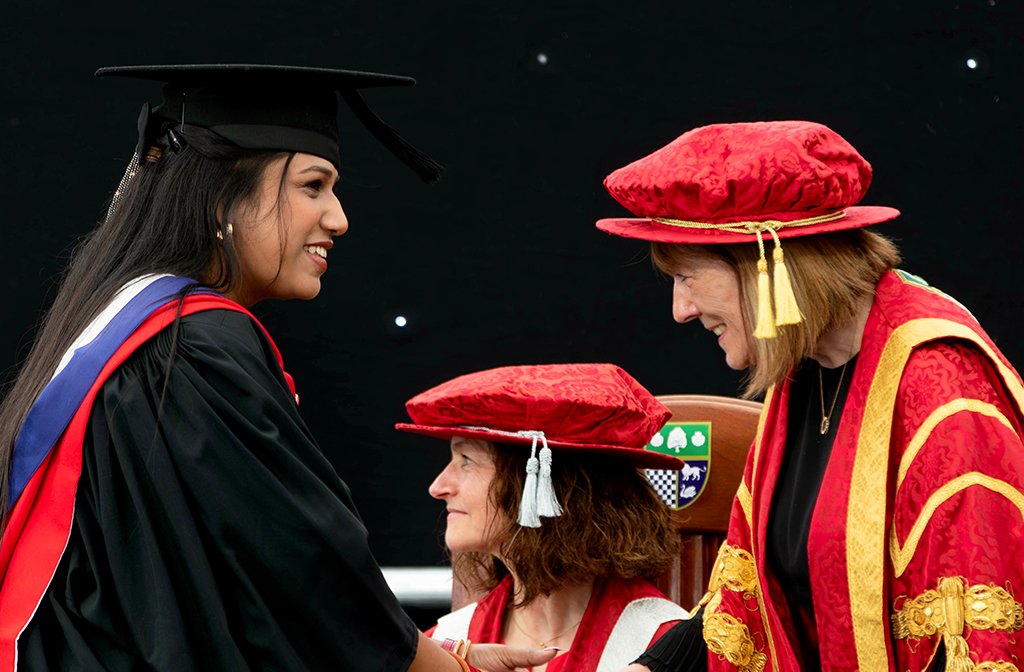A Business School student shakes hands with the VC of the University of Bedfordshire, Professor Rebecca Bunting. Image: UoB.
