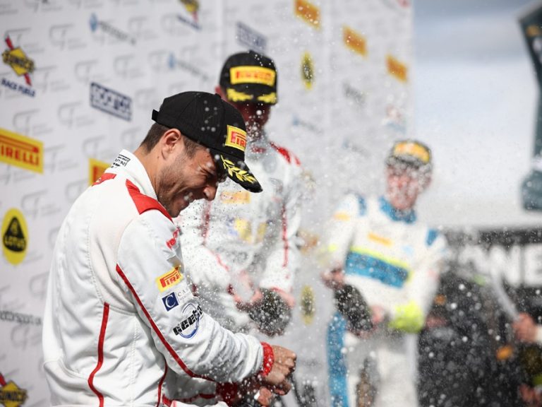 Alex Walker celebrates a podium finish in a British GT Championship event at Donington Park