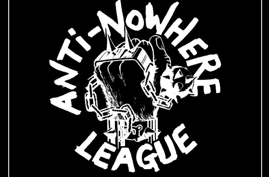 A raised fist wearing spiked knuckle dusters and clasping a mace and chain is surrounded by the words Anti-Nowhere League