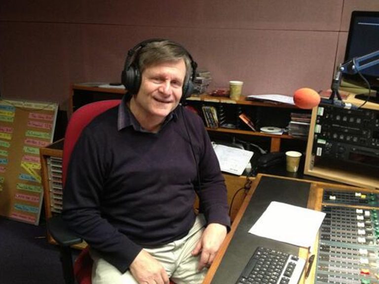 Barry Hyde wearing headphones in the Black Cat Radio studio.