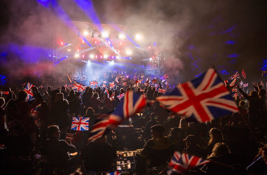 A sea of union jack flag with the stage in at the background at Bedford Park Proms. Image: Cuffe & Taylor