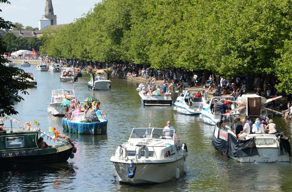 Bedford River Festival regatta along The Embankment on a sunny day.
