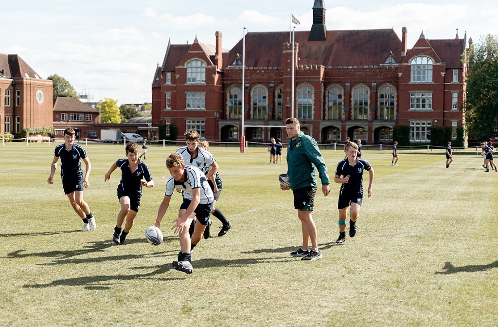 Northampton Saints community coaches with Bedford School students