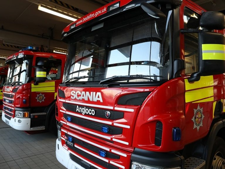 Bedfordshire Fire & Rescue Service red fire trucks in a row.
