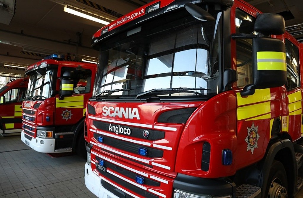 Bedfordshire Fire & Rescue Service red fire trucks in a row.