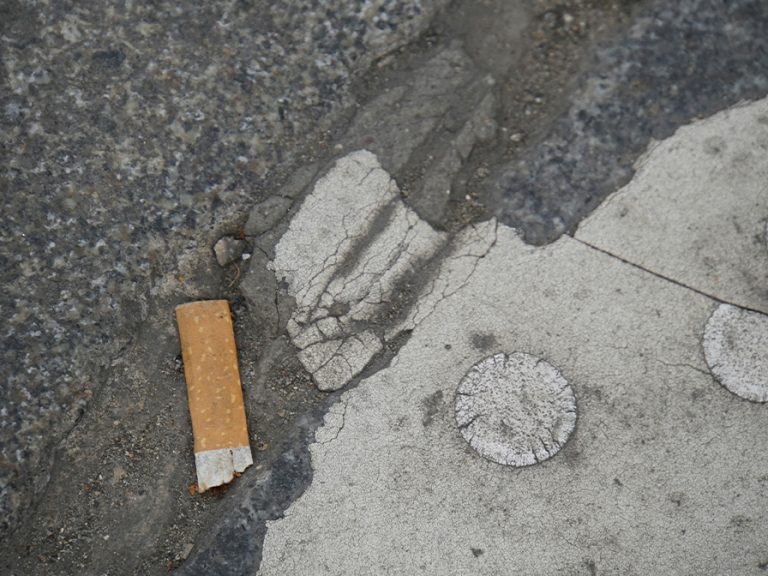 Cigarette butt on the floor. Image: Jan Zinnbauer/Unsplash