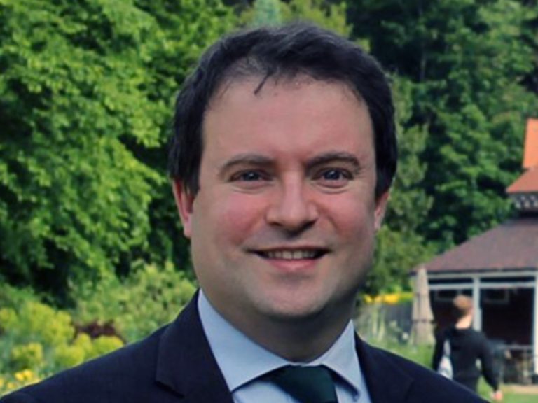 Cllr Henry Vann standing in Bedford Park, You can see parts of the Pavilion coffee shop behind him. Image: Bedford Liberal Democrats