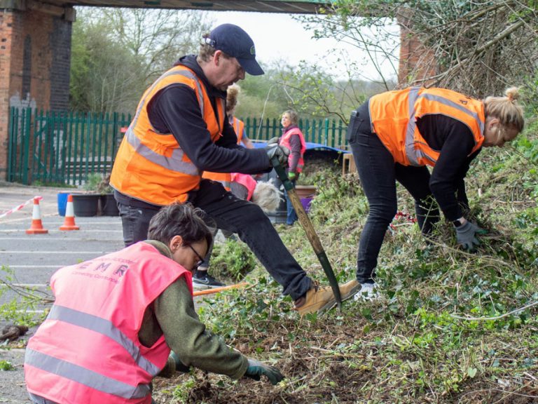 Community groups working near an EMR station. Image: EMR