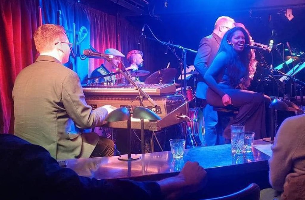 Jazz combo Cong-Fusion performing on stage with singer, Gina Sedman