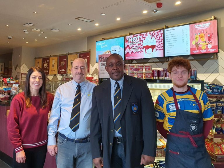 Costa team members with (l-r) David Fray and Micheal Haughton from the Bedford Swifts. Image: Costa Coffee