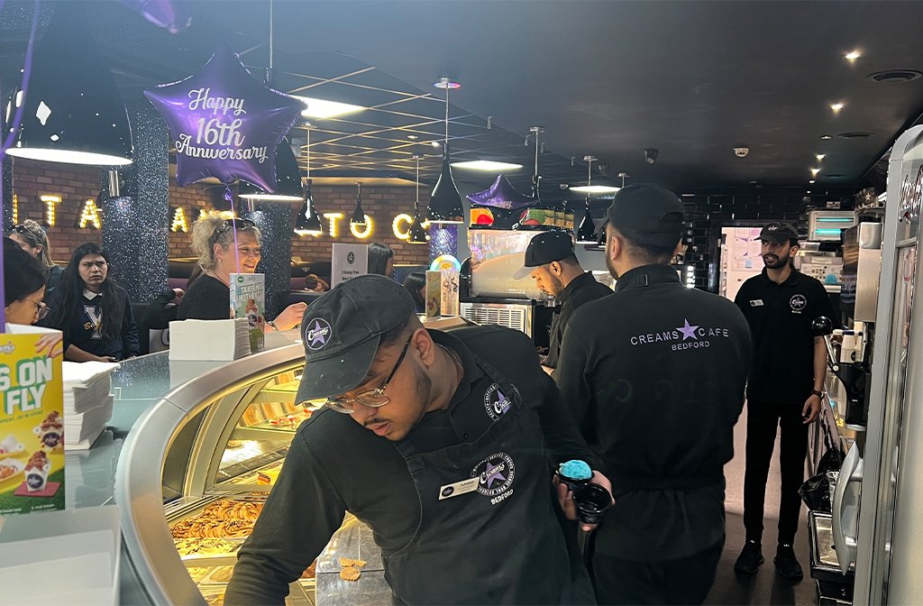 Creams Bedford staff serving ice cream. Image: Bedford Independent