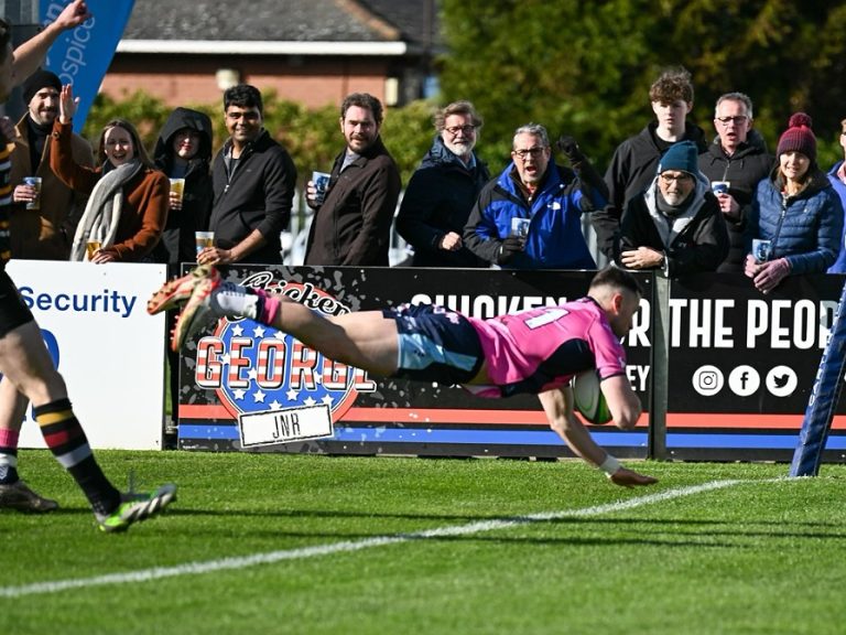 Dean Adamson scores a try against Caldy on Ladies Day at Goldington Road in March 2024