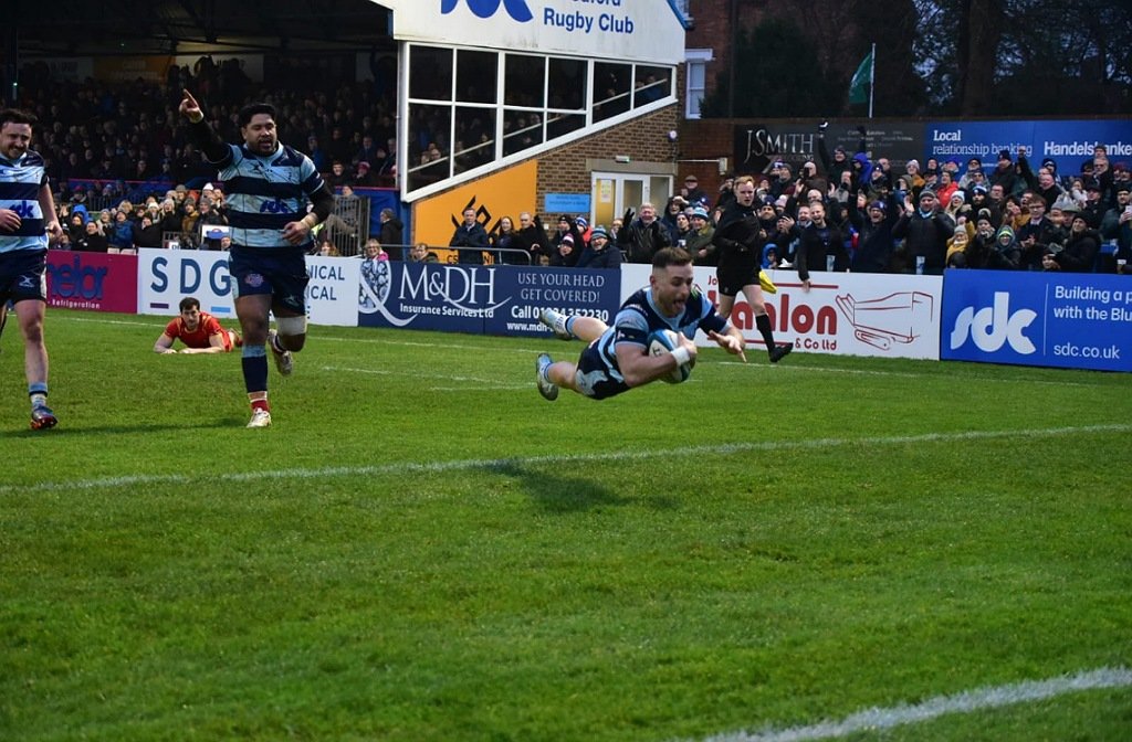 Dean Adamson dives full stretch for a try against Cambridge December 2024