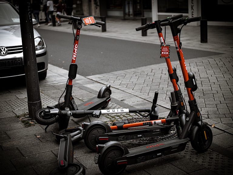 electric scooters on a town pavement
