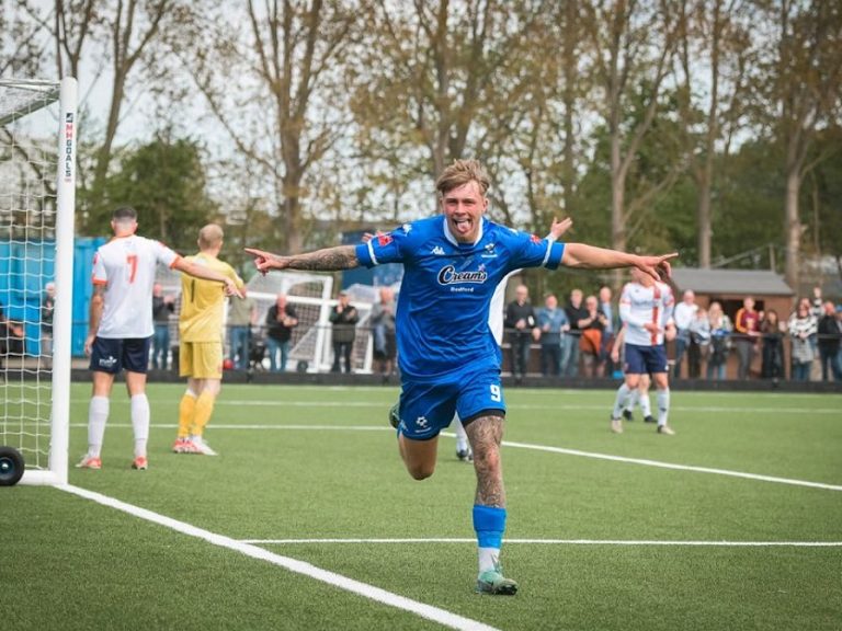 Eddie Panter celebrates scoring against Stratford Town at The Eyrie