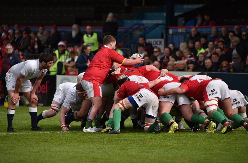 Wales Deaf rugby side and England Deaf Rugby side are in a scrum with Wales taking the ball at Goldington Road
