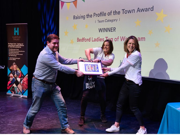 Raising the Profile of the Town team winners Bedford Ladies Tug of War Team with sponsor Martin Steers Bedford Radio
