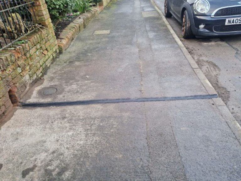 Example of installed charging channel:gully Screenshot of Channels Through Pavements for Electric Vehicles (EV) Car Charging Report
