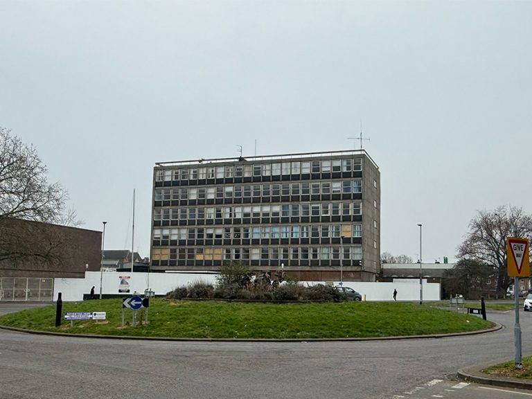 The former Bedfordshire Police station building at Greyfriars, with the roundabout in the foreground. Bedford. Image: Bedford Independent