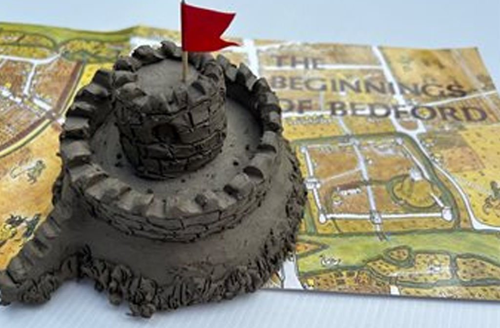 A clay effigy of a Bedford Castle on a map of Castle Mound in Bedford.