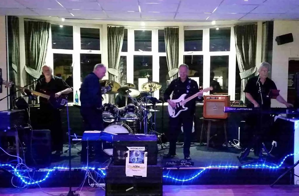 Highstone, a five-piece band perform on stage at a pub