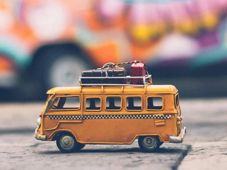 Toy camper van with luggage on the roof. Image: Nubia Navarro (nubikini) / Pexels