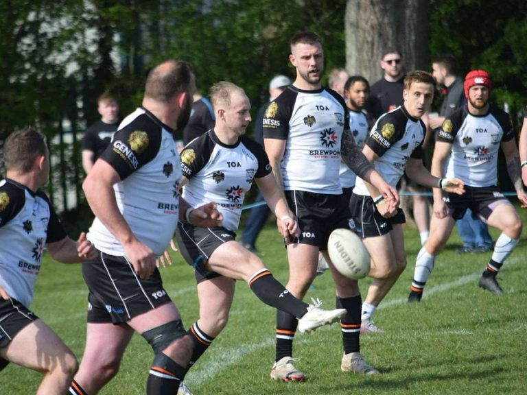 Jack Brown kicks for Bedford Tigers amongst his teammates