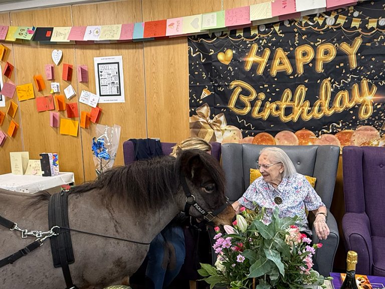 Kay Dovey with Pickles the therapy horse, a treat for her 104th birthday. Image: Bedford Independent