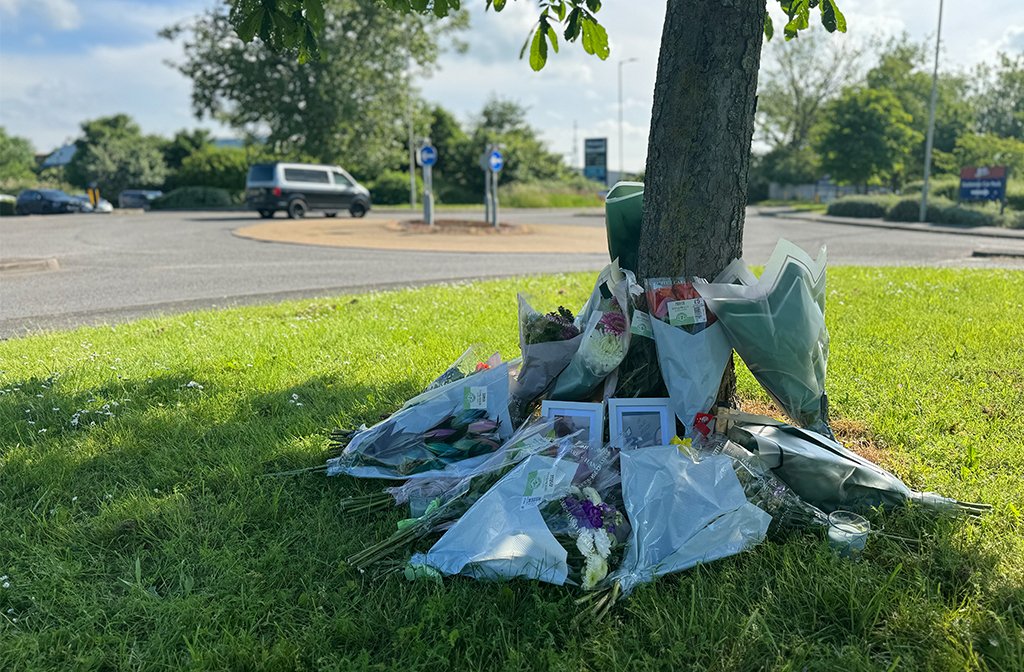 Flowers left on Riverfield Drive in tribute to Leon Penman. Image: Bedford Independent