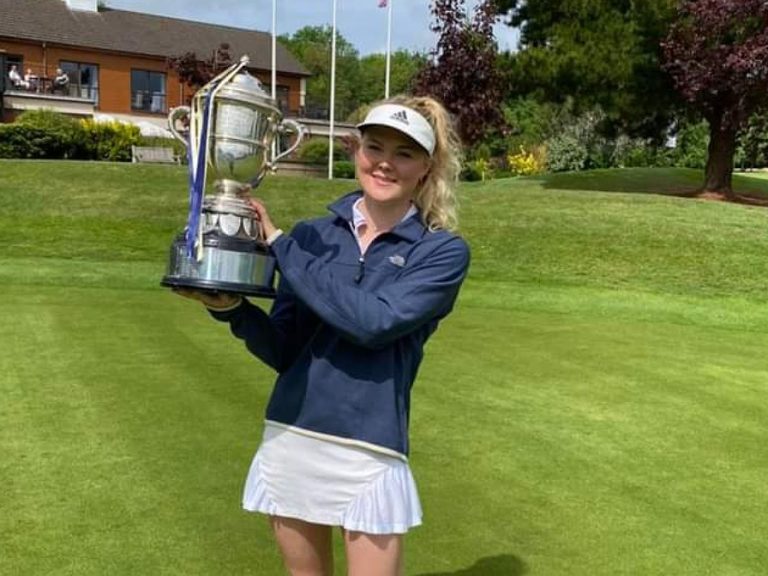 Luca Thompson holding her trophy