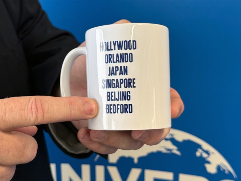 Mayor Tom Wootton's Universal mug with the list of locations for Universal Theme Parks around the world. Image: Bedford Independent