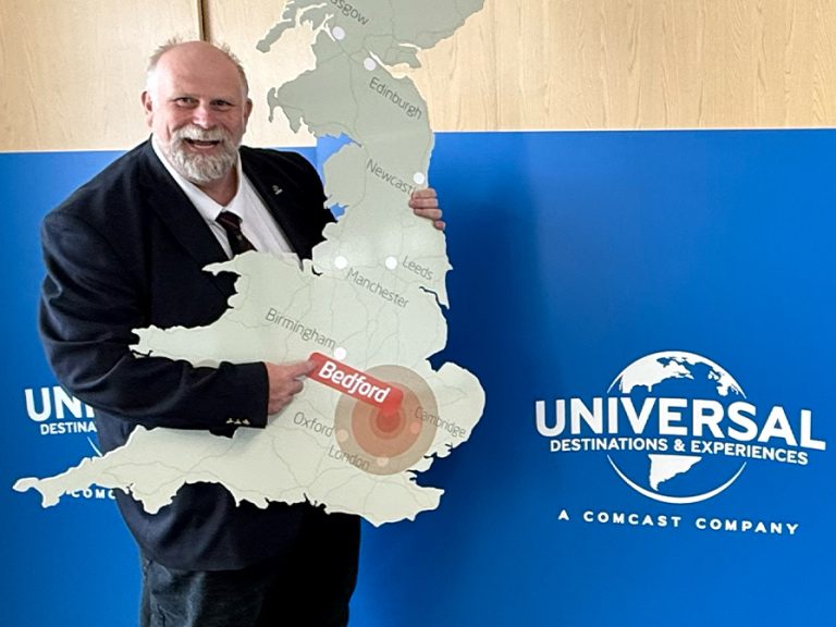 Mayor Tom Wootton holds up a cut out of the UK, showing Bedford as the the location of the proposed new Universal Studios Theme Park. Image: Bedford Independent
