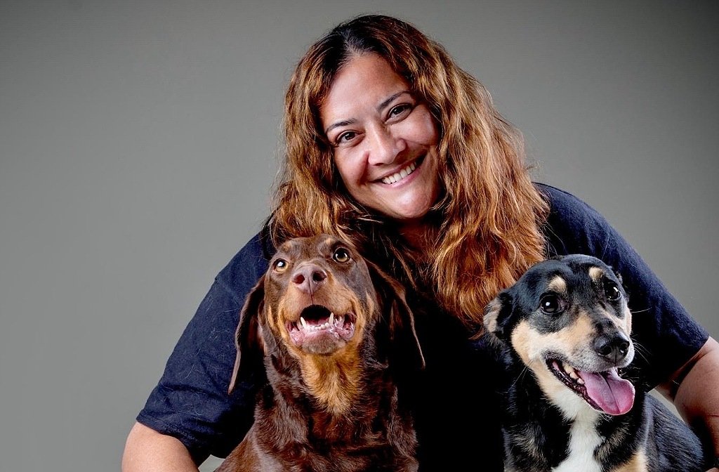 Dog groomer Michelle Jackson with two rescue hounds