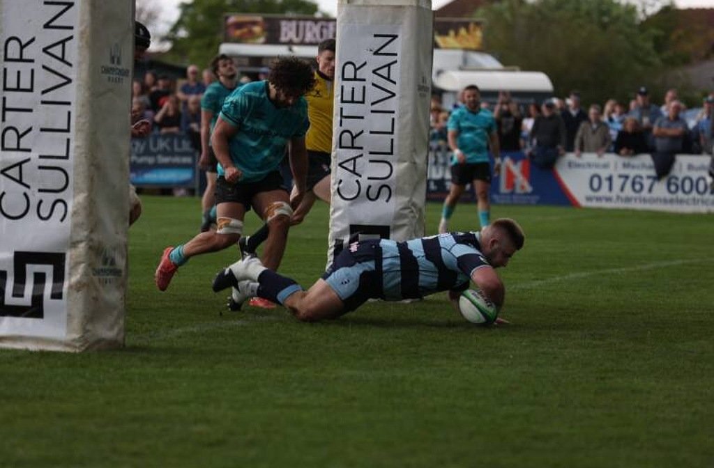 Bedford Blues' Bryan O'Connor dives in under the posts to score a try for Bedford Blues