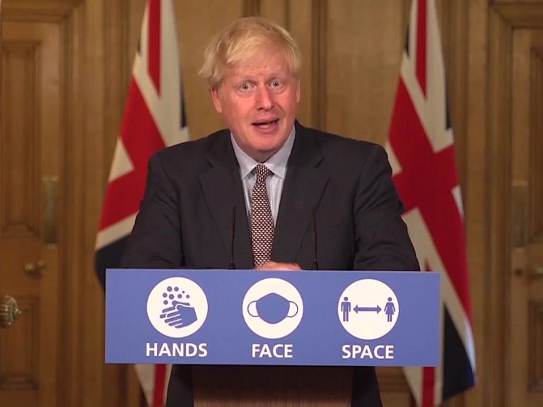 PM Boris Johnson hands face space