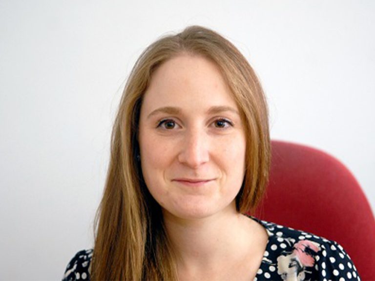 Sarah Cox (Colley) sitting on a red chair and smiling when she was Bedfordshire on Sunday editor. Image: Trinity Mirror/Reach