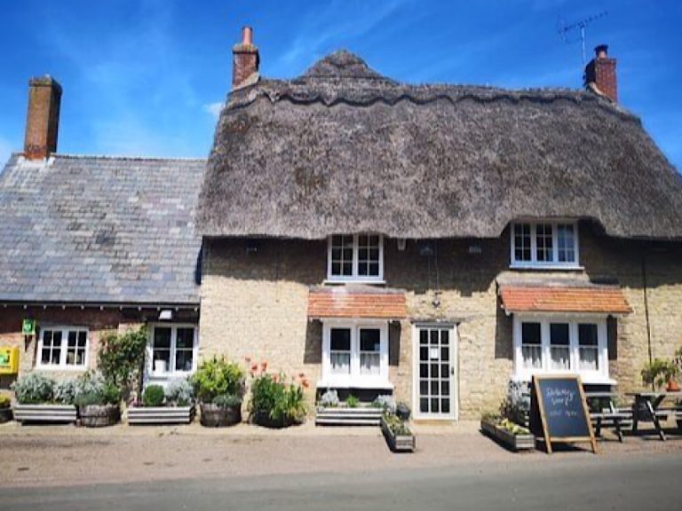 The Sun pub in Felmersham is a traditional English village pub with a thatched roof