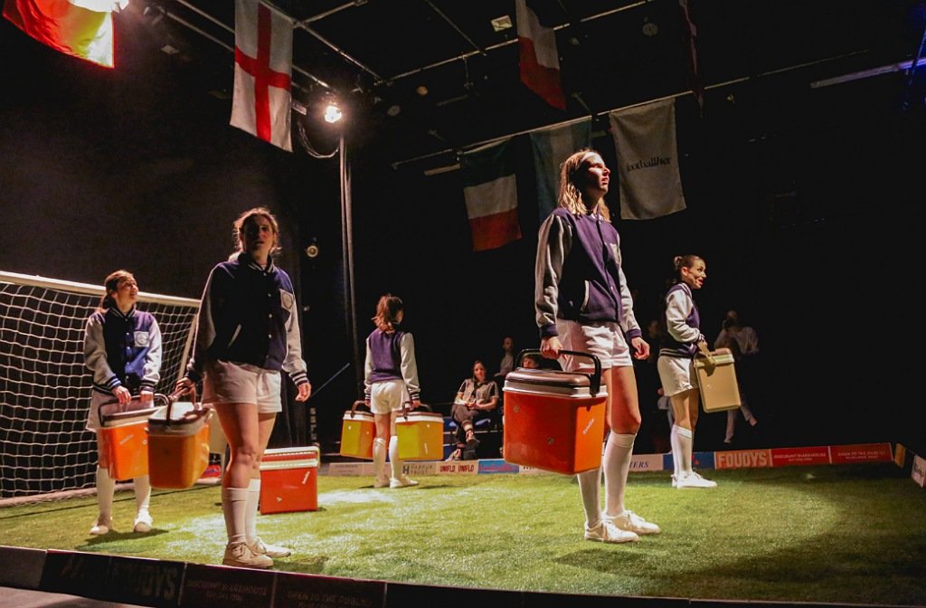 The cast of the Lost Lionesses play on stage at The Place Theatre
