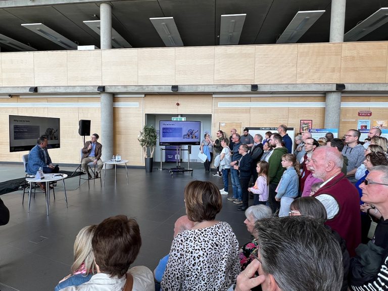 Universal Theme Park & Resorts' president of new ventures, Page Thompson, (right) addresses Bedfordians at Kimberley College during their first public theme park event 23 April 2024
