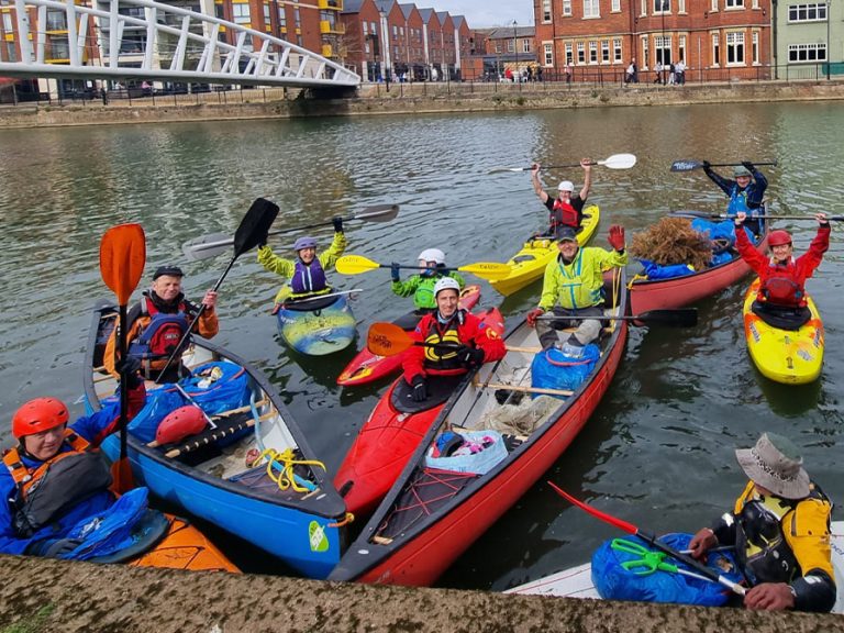 Volunteers from the Viking Kayak Club are pictured in their canoes/kayaks on the River Great Ouse near St Mary's Gardens