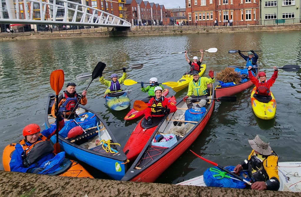 Volunteers from the Viking Kayak Club are pictured in their canoes/kayaks on the River Great Ouse near St Mary's Gardens