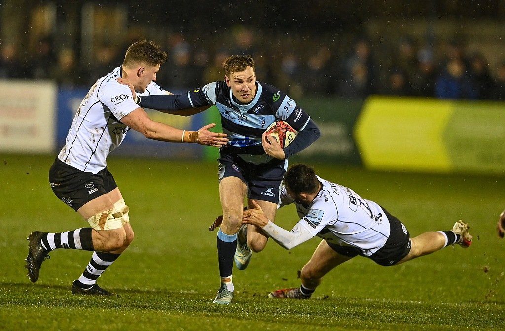 Will Maisey for Bedford Blues tackled by two Bristol players