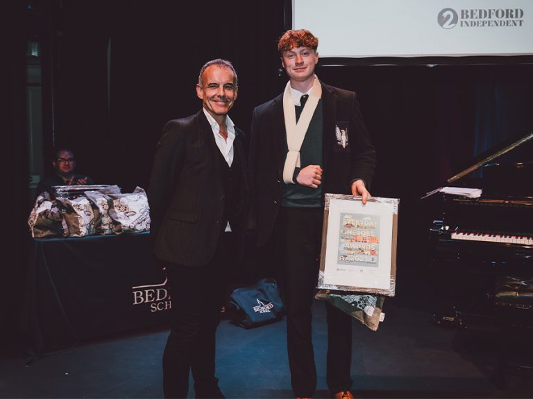 Young Achiever (14 to 21) winner Charlie Faulkner with Tim Pain of Bedford Heights