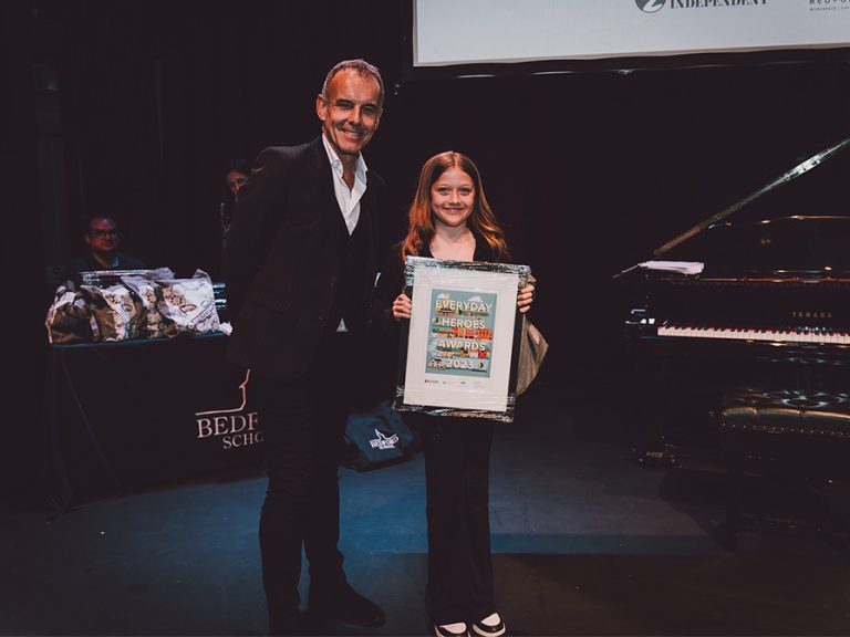 Young Achiever (up to 13) winner Lola Bracey with Tim Pain of Bedford Heights