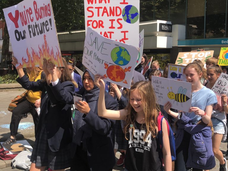 Protesters at the #YouthStrike4Climate march in Bedford town centre.