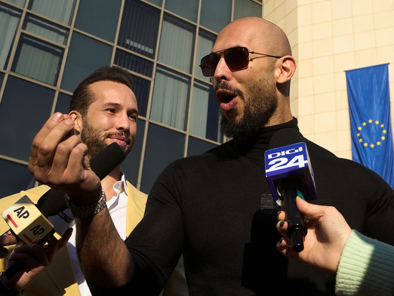 (l-r) Tristan Tate and his brother Andrew speaking to media outside a Bucharest Court in January 2025. Image: LCV/Shutterstock.com