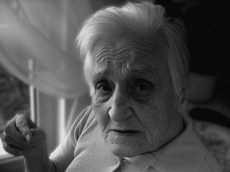 A black and whilte photograph of an older lady