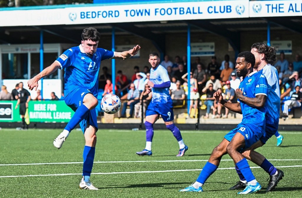 Bedford Town player tries to get a shot off in their game against Alfreton Town at The Eyrie in August 2025
