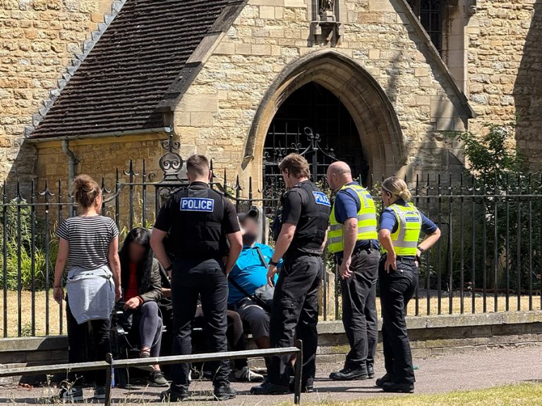 Bedfordshire Police officers speaking with people congregating on St Peter's Green in Bedford Image Bedford Independent